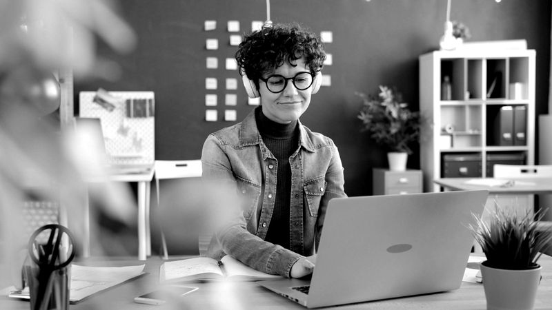 Customer support specialist working on a laptop