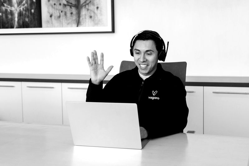 Consultant with a headset on a video call with a customer