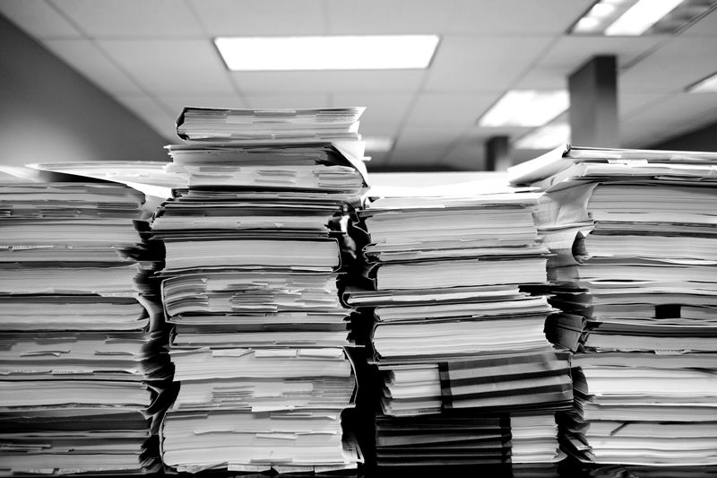 Piles of document folders in an office