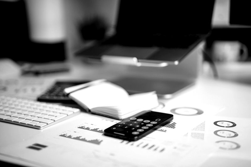 Financial reports and a calculator on a desk