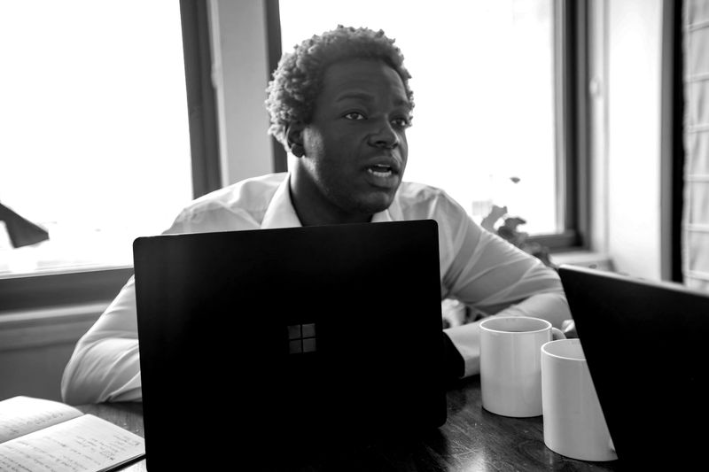 Manager presenting a report at a laptop
