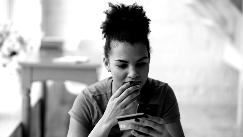 Shopper paying for an order on her phone