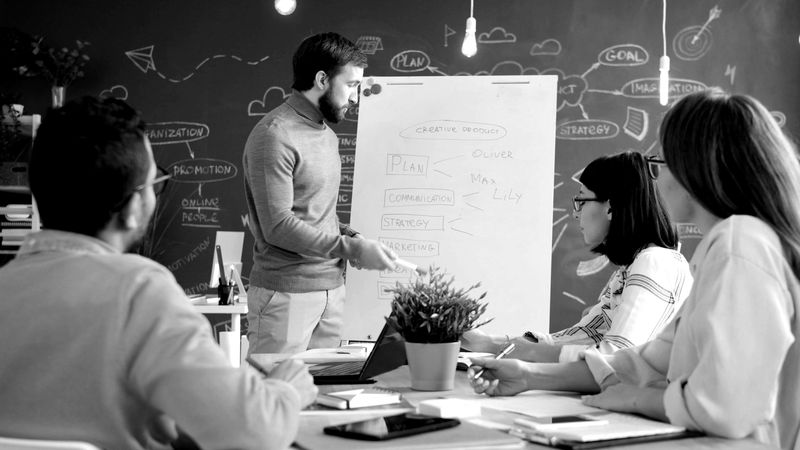 Team meeting at a whiteboard