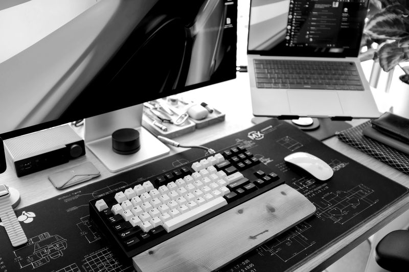 Developer desk with keyboard and screens